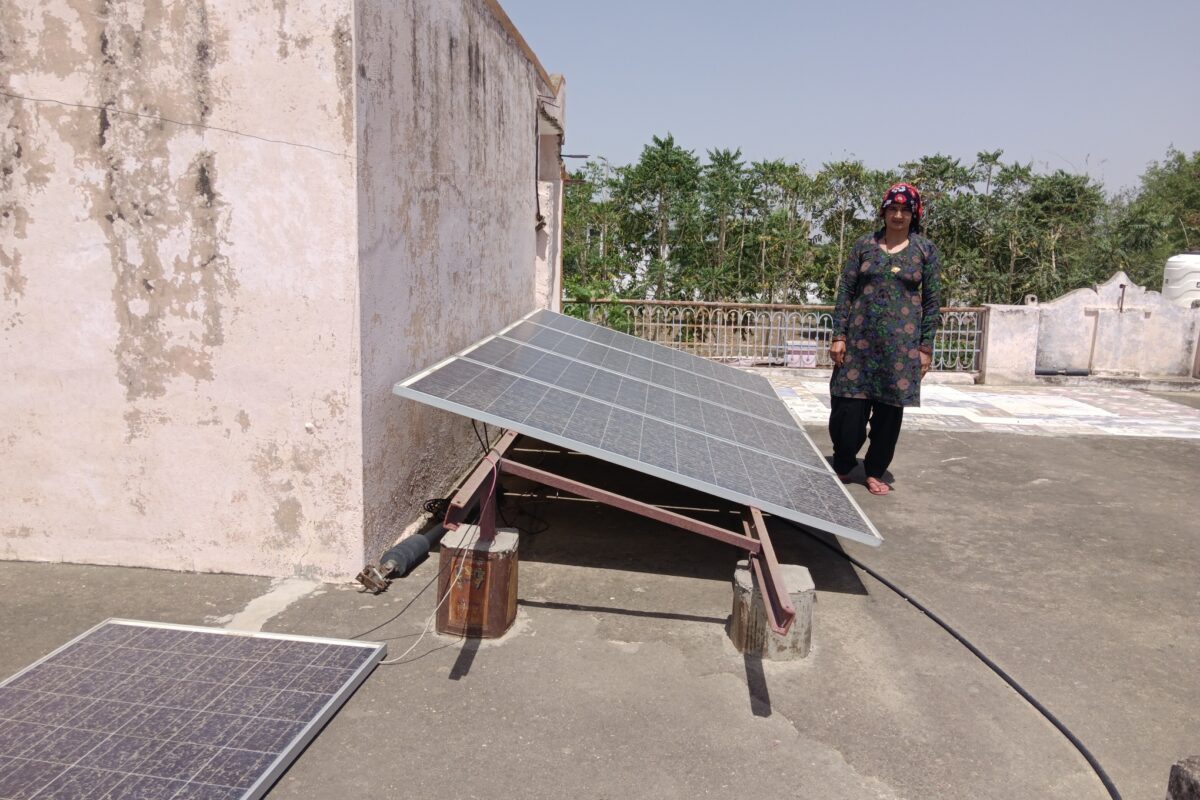 lesh Devi showing solar panel at her home, many of which broke because of heavy winds. These solar panels were originally meant for solar pumps and are being used in the house after the solar pumps stopped working. Photo by Parul Kulshrestha/Mongabay.